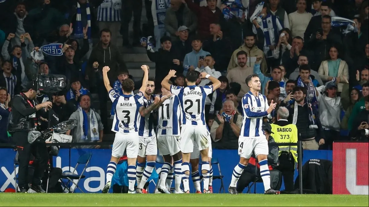The Real Sociedad players celebrate a goal.