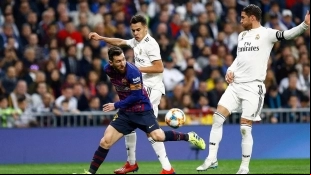 Sergio Reguilón, Sergio Ramos, and Leo Messi during a Real Madrid - FC Barcelona