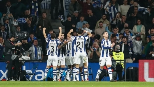 The Real Sociedad players celebrate a goal.